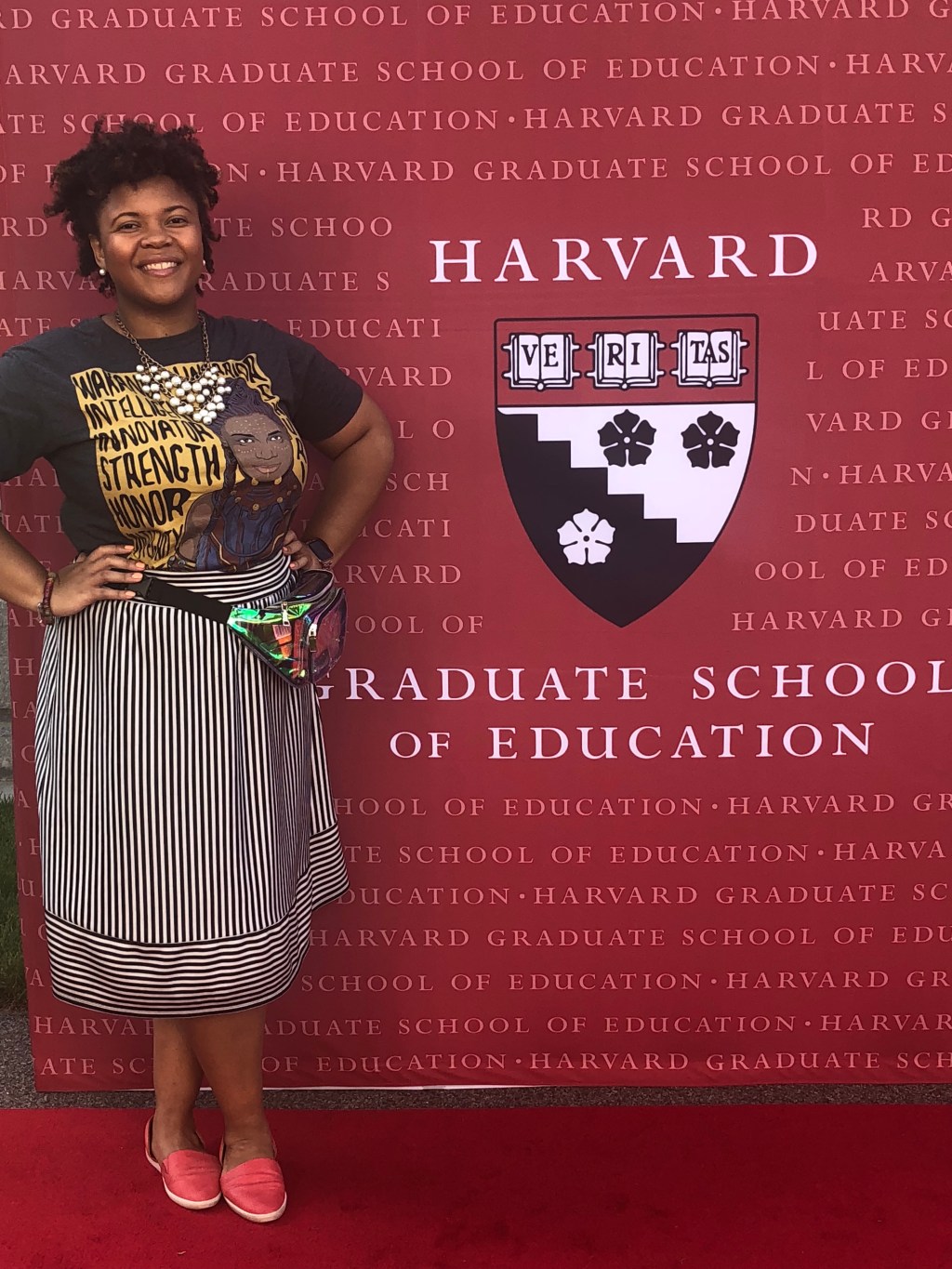 Author Erica Jordan-Thomas in front of an HGSE back drop