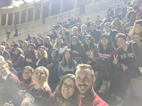 A group of HGSE students at a Harvard football game 