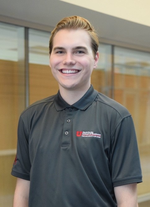 A person smiling for the camera
Description automatically generated